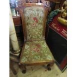 A Victorian carved chair, with tapestry seat and back