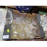 Two boxes of assorted drinking glasses, to include etched examples.