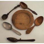 Three 19th century Continental wooden spoons, together with half a spoon mould, a pewter spoon and a
