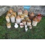Seven stoneware bottles, some with wicker mounts and a jug