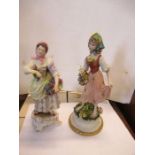 A continental porcelain figure, of a woman collecting grapes, height 9.5ins, together with another
