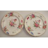 Two 19th century Swansea style plates, decorated with floral sprays to a shaped gilt edge, one