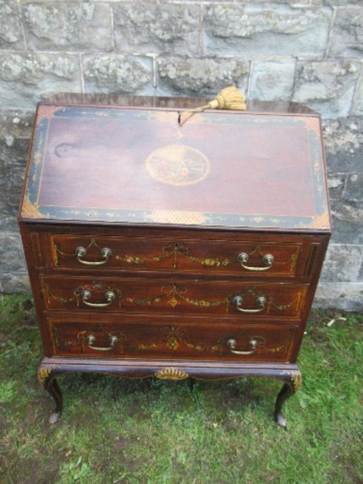 A mahogany bureau, with painted decoration, the fall flap having panel of neoclassical figures,