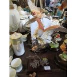 Two Royal Worcester porcelain and bronze models of birds, on wooden bases