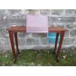 A mahogany reading stand, having ratcheted book rest, width 37.5ins, height 26ins