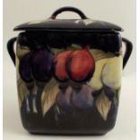A Moorcroft Pottery covered biscuit barrel, of square form, decorated in the Wisteria pattern, lid