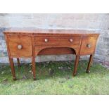 A 19th century mahogany bow front sideboard, the central frieze cutlery drawer flanked by a drawer