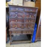 A 18th century chest of drawers, on later stand,  with moulded decoration, and replacement