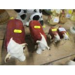 Two Beswick Champion models, bull and cow, together with two Beswick calf models - all in good