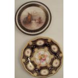 A Royal Worcester plate, decorated with flowers to a blue and gilt border, diameter 10ins,