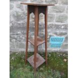 A mahogany plant stand, with two shelfs below, height 48ins, the top 12ins sq