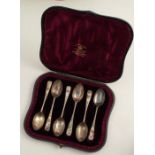 A cased set of six silver and enamel coffee spoons, decorate with different flowers, London 1887