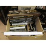 A box of assorted  frames, prints, etc.