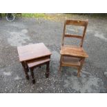 A metamorphic library chair, together with a nest of two tables