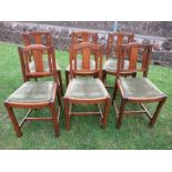 A set of six oak arts and crafts style chairs