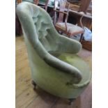 A green deep buttoned back easy chair
