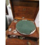 A cased wind-up gramophone, bearing label Academy No.2, with accessories