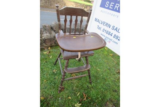 A continental wooden child's high chair