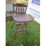 A continental wooden child's high chair