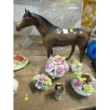 Beswick bay horse and goldfinch models, together with four encrusted flower ornaments