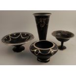A black pottery trumpet vase, inlaid with silver, height 11ins, together with three other similar