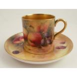 A Royal Worcester coffee can and saucer, painted to the exterior of the can and the saucer with