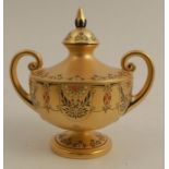 A Royal Worcester two handled urn shape vase and cover, with gold ground decorated in black, red and