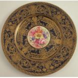 A Royal Worcester cabinet plate, decorated with flowers to the centre by Freeman, with blue and gilt