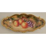 A Royal Worcester oval pin dish, decorated with hand painted fruit, diameter 10ins - two chips to