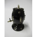 A Victorian treen ebony string holder, in the form of a barrel with a brass tap forming the