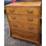 A 20th century walnut chest, of four long drawers, raised on bracket feet, width 31ins, depth 18.