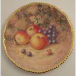 A Royal Worcester cabinet plate, decorated with fruit to a mossy background by H Aryton, with gilt