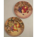 Two Royal Worcester plates, decorated with hand painted fruit by Freeman and J Smith, diameter 10.