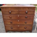 A 19th century oak chest, of two short over three long drawers, with satinwood inlay, raised on