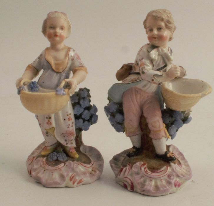 A pair of figures, harvest gatherers against a tree stump, with AR marks to the base, height 4.5ins