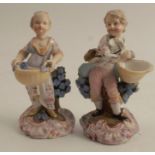 A pair of figures, harvest gatherers against a tree stump, with AR marks to the base, height 4.5ins