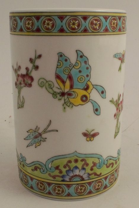 A 20th century Chinese cylindrical vase, decorated with butterflies, height 5ins