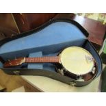 A wooden banjo in a case