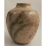 A studio pottery vase, decorated with a beige glaze, marked CH to base, height 7ins