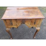 An Antique walnut low boy, fitted with three frieze drawers, 30.5ins x 18ins, height 29ins