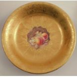 A Royal Worcester dish, decorated with a hand painted fruit centre by Reed, to an acid gilt
