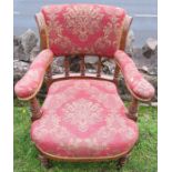 An Edwardian mahogany upholstered and showwood nursing chair, with carved decoration
