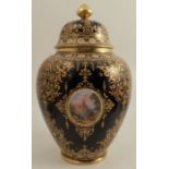 A Coalport covered vase, decorated with oval reserves of Continental landscapes, with jewelled