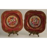 A pair of Royal Worcester square plates, decorated with flowers by Earnest Barker, to a red and gilt
