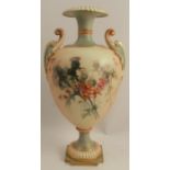 A Royal Worcester blushed ivory two handled vase, raised on a pedestal, decorated with thistles