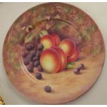 A Royal Worcester cabinet plate, decorated with fruit to a mossy background by Holloway, diameter