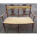 An Edwardian two seated bedroom settee, with pierced splats to the back, width 45ins