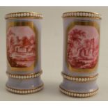 A pair of 19th century Spode spill vases, the pale purple ground reserving a landscape panel painted