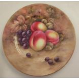 A Royal Worcester cabinet plate, decorated with fruit to a mossy background, unsigned, diameter 10.