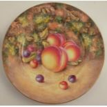 A Royal Worcester cabinet plate, decorated with fruit to a mossy background by G Bowen, diameter
